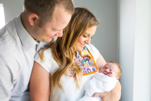 parents holding newborn
