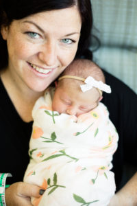 mom holding newborn baby