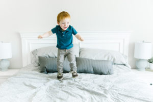 toddler jumping on the bed