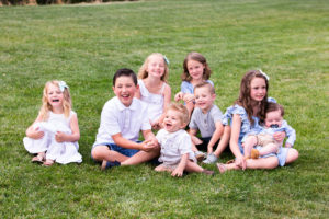 grandkids photo laughing sitting on grass