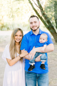 Small family photo holding a baby