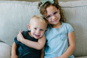 Sister and brother hugging