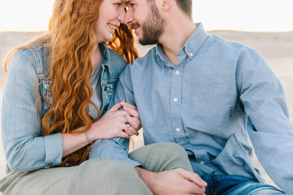 couple looking into each other's eyes at Little Sahara sand dunes 