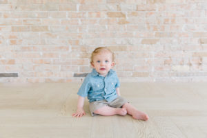 one year old sitting on the floor